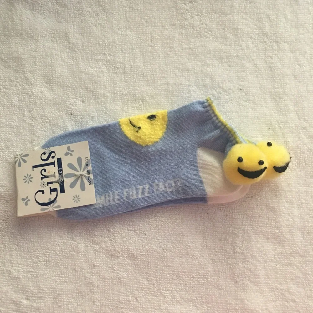 NWT smile fuzz ball socks